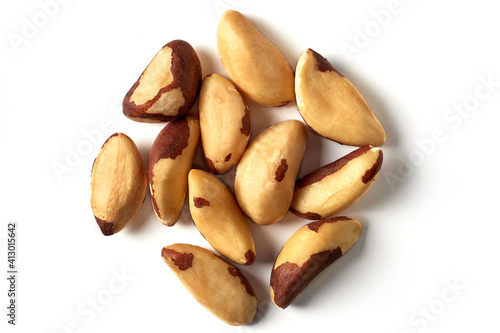 Brazil nuts. Isolated on white background, place for text, top view.