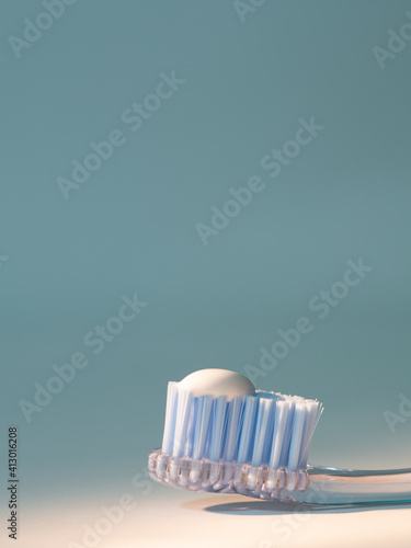 toothbrush with the right amount of toothpaste. proper dental hygiene concept  dental care  vertical stock image. 