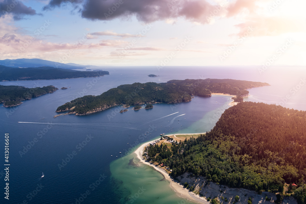 Aerial view of Thormanby Island on the Pacific West Coast during a sunny summer evening. Sunset Sky Art Render. Taken in Sunshine Coast, BC, Canada.