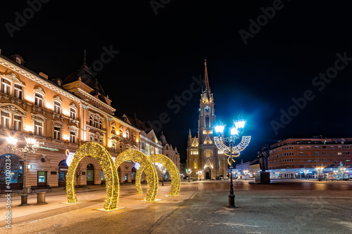 Novi Sad, Serbia January 05, 2021: Holy Mary church landmark in city center with christmas lights in Novi Sad, Serbia.