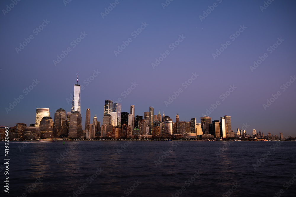 New York City Skyline at Dusk with a beautiful purple sky and warm sunset glow