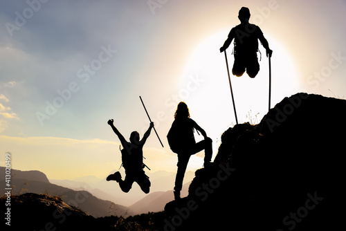 silhouette and enthusiasm of energetic, active and successful climbers