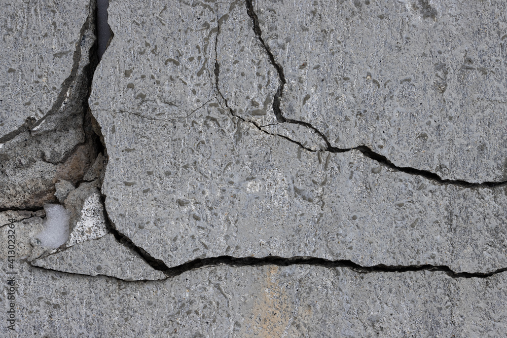 Obraz premium Texture of old cracked concrete wall. Rough gray concrete surface. Great for background and design. Close-up. High resolution.