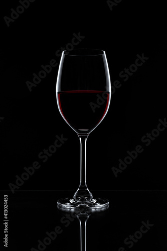 Red wine in a glass isolated on black background - realistic photo image - with clip path