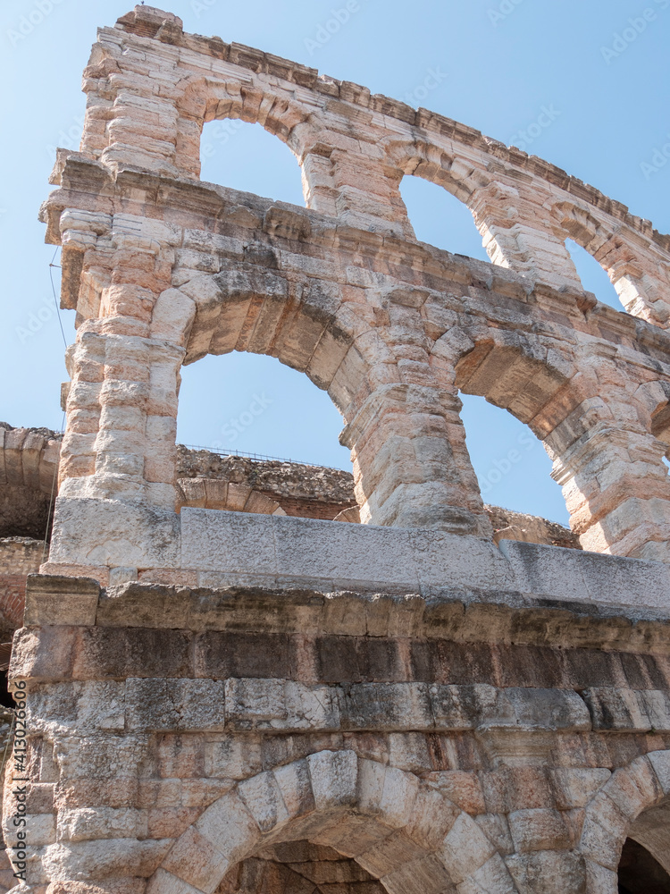 an exterior low angle close view of the colosseum in verona