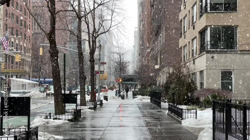 beautiful snow falling snowing in Manhattan Lower 5th Ave winter New York City NYC