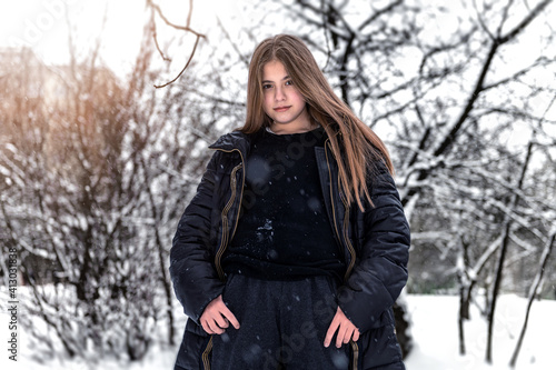 Beautiful sad winter girl portrait. Girl outdoors in winter