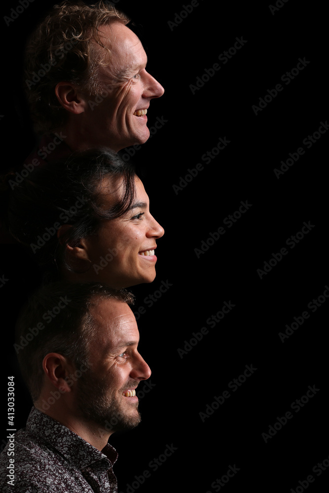 Fototapeta premium Group of beautiful people in front of a black background