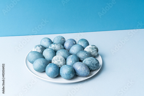 Easter banner with colored eggs on blue background.