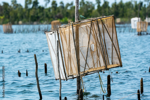Africa, Madagascar, Lake Ampitabe. Fishing traps are elevated along the shallow channel of Lake Ampitabe. photo