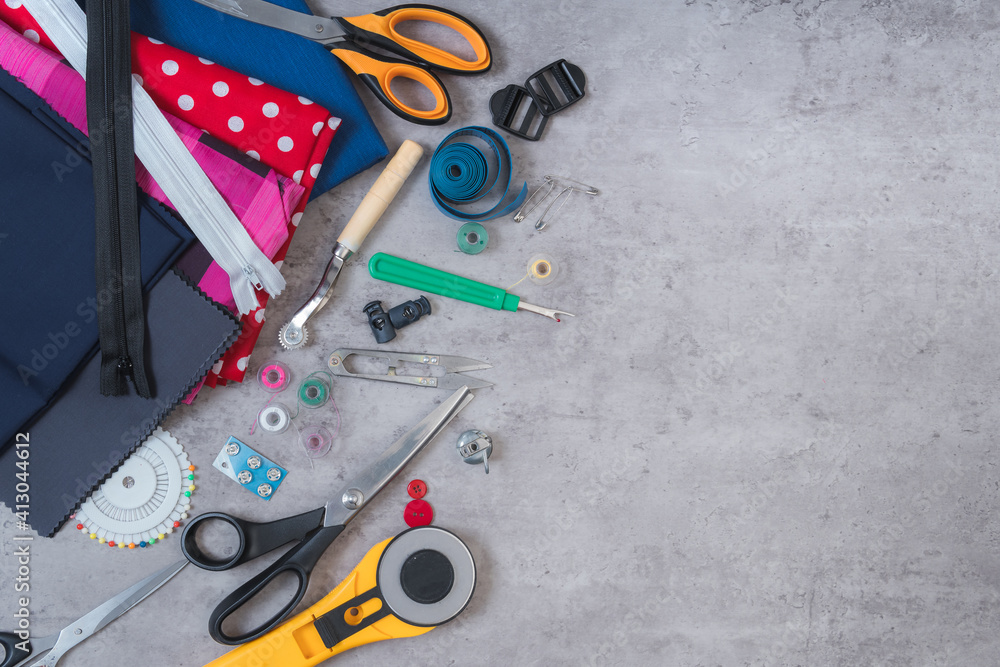 Close-up to a table where there are tools of a tailor