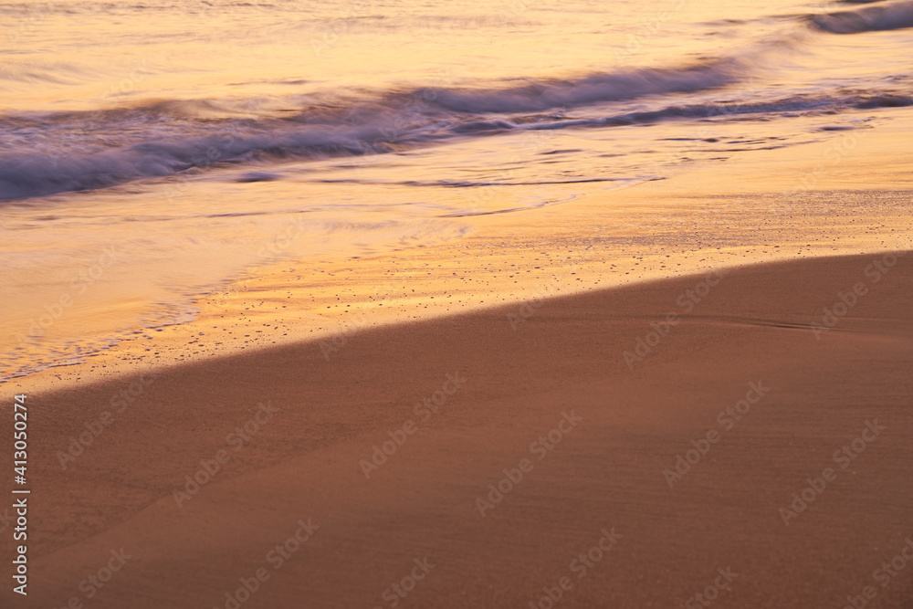 Sandy tropical beach at sunset as a backdrop. Sandy tropical beach at sunset as a backdrop.