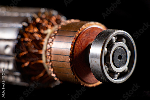 Rotor of a small electric motor. Spare parts in the electrical workshop. photo
