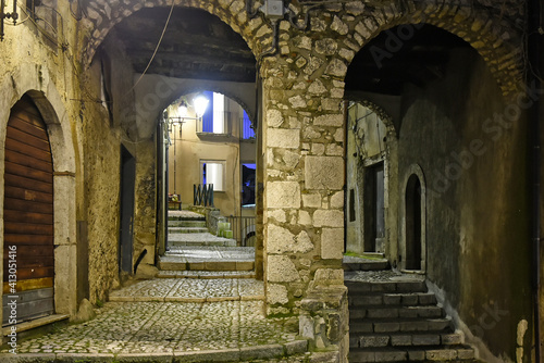 A narrow street between the old houses of Guardia Sanframondi  a medieval village in the province of Salerno  Italy.