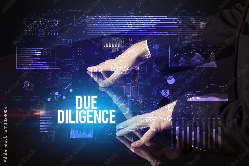 Businessman touching huge screen with DUE DILIGENCE inscription, cyber business concept Businessman touching huge screen with DUE DILIGENCE inscription, cyber business concept