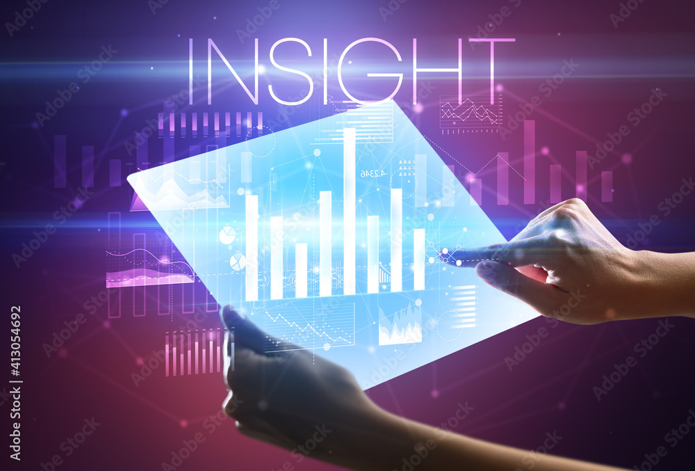 Hand holding futuristic tablet with INSIGHT inscription above, modern business concept Hand holding futuristic tablet with INSIGHT inscription above, modern business concept