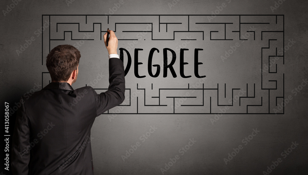businessman drawing maze with DEGREE inscription, business education concept businessman drawing maze with DEGREE inscription, business education concept