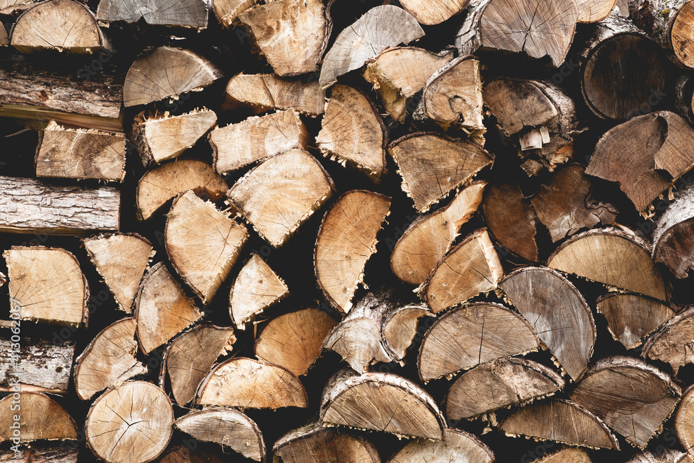 Fototapeta premium Stack of split firewood ready for burning
