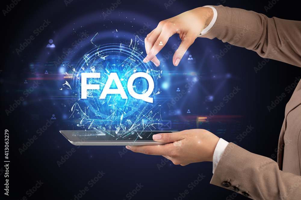 Close-up of a touchscreen with FAQ abbreviation, modern technology concept Close-up of a touchscreen with FAQ abbreviation, modern technology concept
