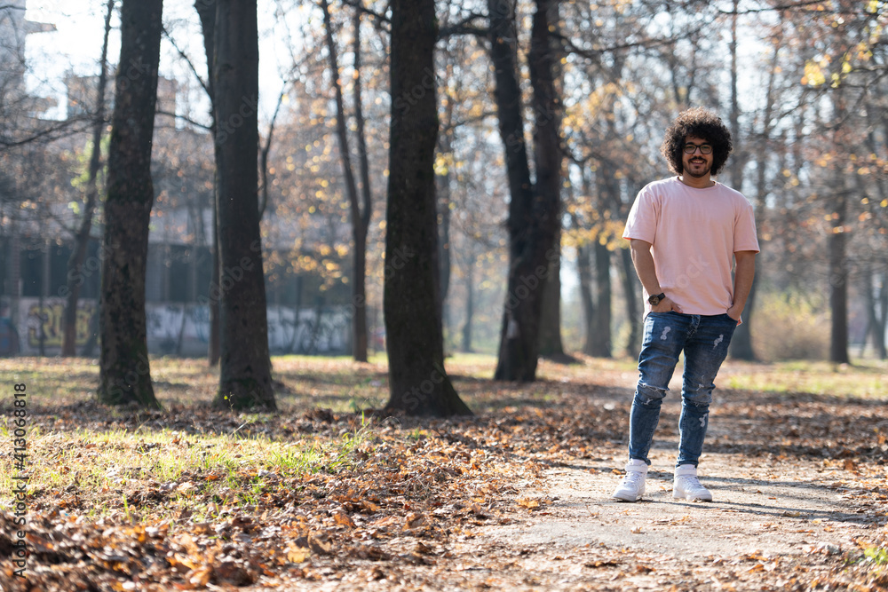 Trendy Handsome Man Posing in Autumn Park Alone Trendy Handsome Man Posing in Autumn Park Alone