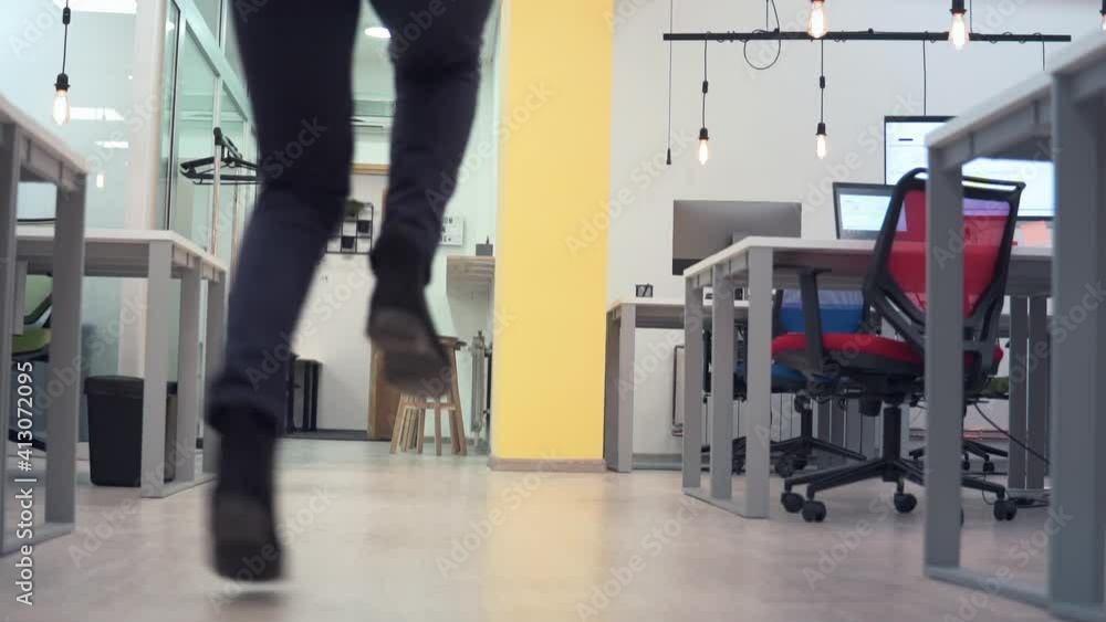 Successful business people team in run, walk along office corridor and dancing, jumping in slow motion Successful business people team in run, walk along office corridor and dancing, jumping in slow motion