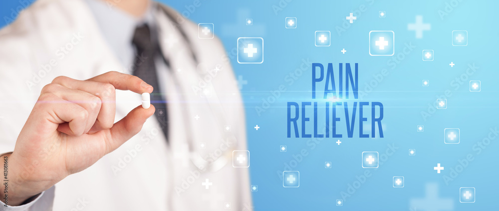 Close-up of a doctor giving a pill with PAIN RELIEVER inscription, medical concept Close-up of a doctor giving a pill with PAIN RELIEVER inscription, medical concept