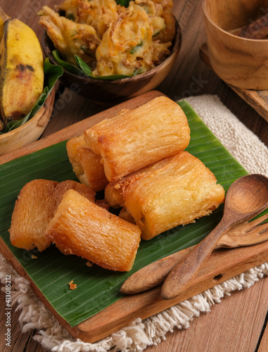 Fried Cassava served on wooden table