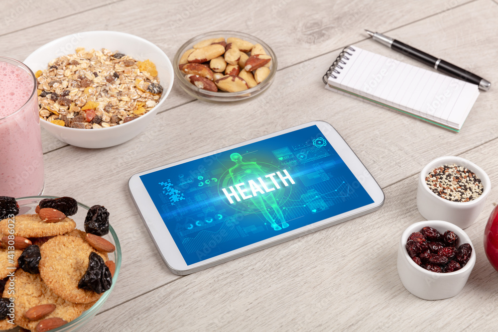 HEALTH concept in tablet with fruits, top view HEALTH concept in tablet with fruits, top view