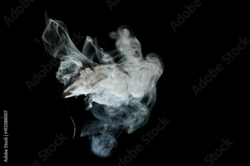 Smoke electronic cigarette on dark background