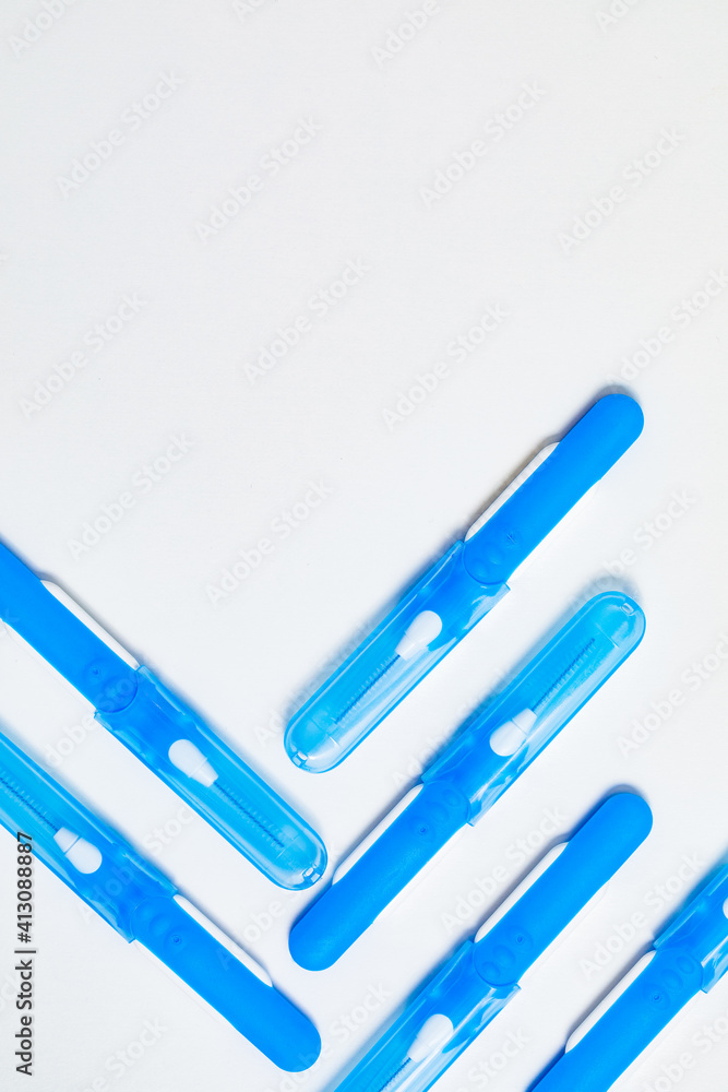 Obraz premium Blue with white interdental brushes. Oral hygiene. Brush your teeth thoroughly. Interdental-Sticks 