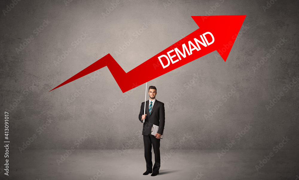 Young business person in casual holding road sign with DEMAND inscription, business direction concept