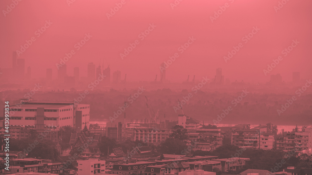 The blurred abstract background of the morning sun exposure to the tiny dust particles that surround the tall buildings in the capital, the long-term health issue of pollution. The blurred abstract background of the morning sun exposure to the tiny dust particles that surround the tall buildings in the capital, the long-term health issue of pollution.
