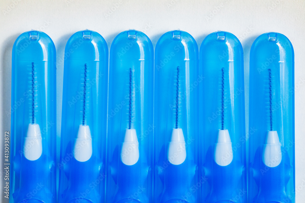 Blue with white interdental brushes. Oral hygiene. Brush your teeth thoroughly. Interdental-Sticks
