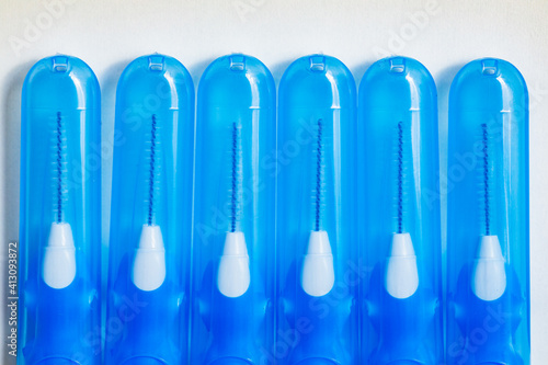 Blue with white interdental brushes. Oral hygiene. Brush your teeth thoroughly. Interdental-Sticks