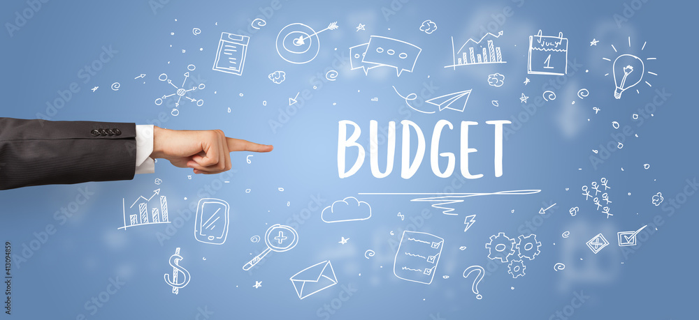 Close-Up of cropped hand pointing at BUDGET inscription, modern business solution concept Close-Up of cropped hand pointing at BUDGET inscription, modern business solution concept