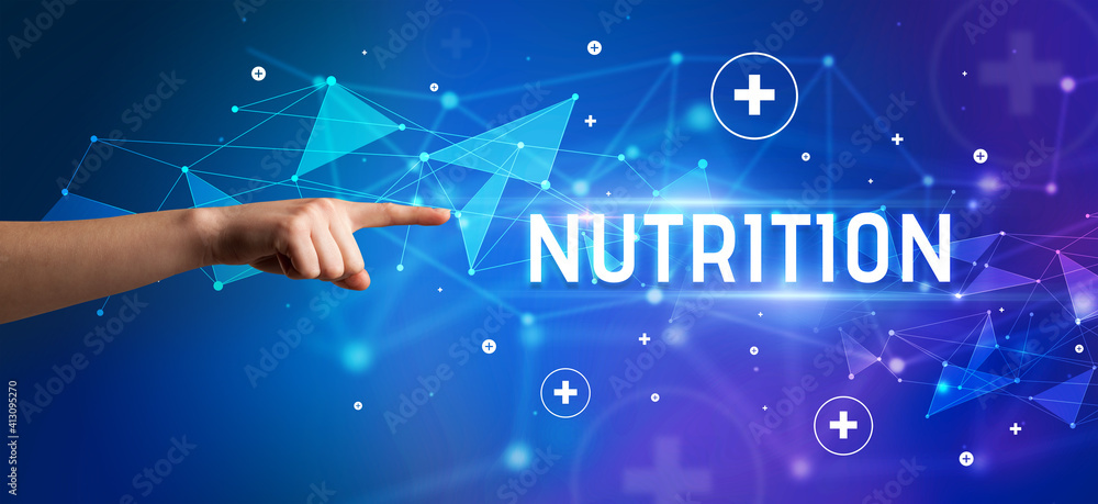 Close-Up of cropped hand pointing at NUTRITION inscription, medical concept Close-Up of cropped hand pointing at NUTRITION inscription, medical concept