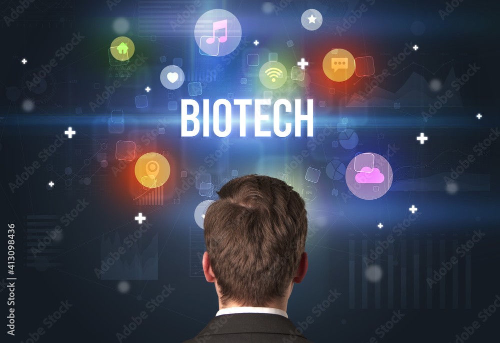 Rear view of a businessman with BIOTECH inscription, modern technology concept Rear view of a businessman with BIOTECH inscription, modern technology concept