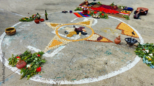 Andean cross, Chakana or Ceremony in homage to Pachamama (Mother Earth) - is an aboriginal ritual of the indigenous peoples of the central Andes. Cross made from plants, food, seeds. Ecuador, Cuenca