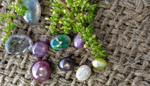 Close up view precious and rare gemstones kept on a jute cloth