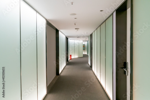 A modern office building with glass doors and windows