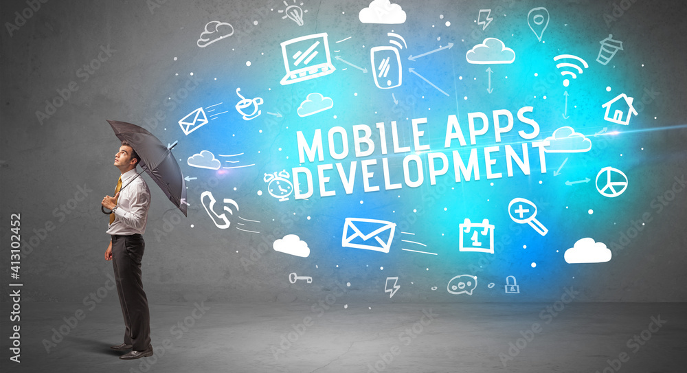 Businessman defending with umbrella from MOBILE APPS DEVELOPMENT inscription, modern technology concept Businessman defending with umbrella from MOBILE APPS DEVELOPMENT inscription, modern technology concept