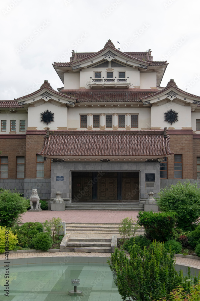 Japanese-built building on the background of a decorative landscape, local History Museum of the city of Yuzhno-Sakhalinsk, Sakhalin Island. summer 2020 Japanese-built building on the background of a decorative landscape, local History Museum of the city of Yuzhno-Sakhalinsk, Sakhalin Island. summer 2020