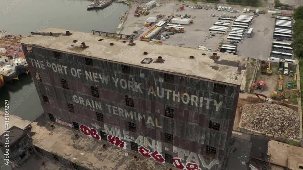 Rotating close up aerial view of Red Hook grain terminal in New York