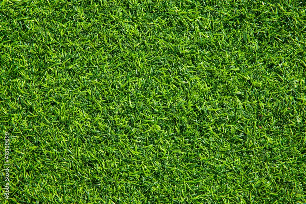 Naklejka New Green Artificial Turf Flooring texture and background seamless