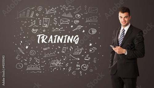 Businessman thinking with TRAINING inscription, business education concept