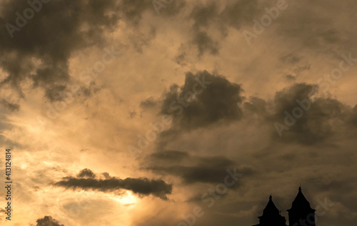 Orange sky full of cloud with church silhoutte in minas gerais  brazil
