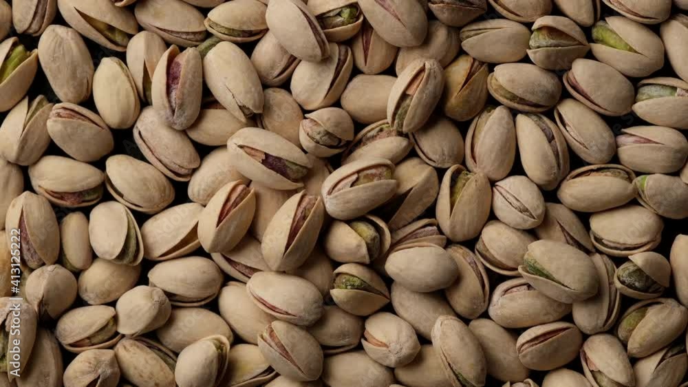 salt pistachios nuts top view. Pistachio nuts in the peel. Whole nut kernels salt pistachios nuts top view. Pistachio nuts in the peel. Whole nut kernels