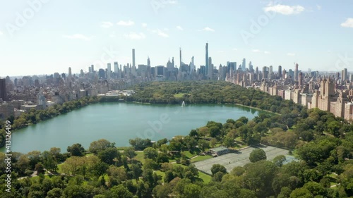 Aerial Drone Flight forward Dolly above Green Central Park in Manhattan, New York City in Summer