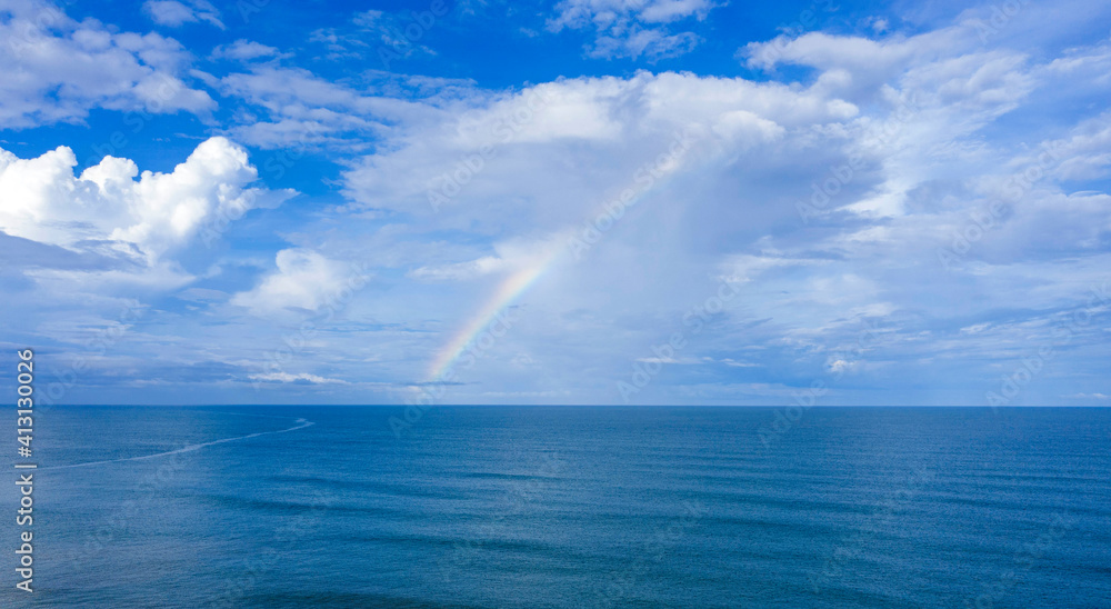 rainbow over the ocean / sea