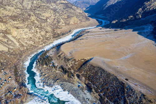 Aerial view of Katun river and Ilgumen rapid on sunny winter day. Altai Republic, Siberia, Russia.. photo